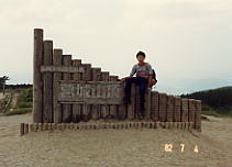 ��a����R